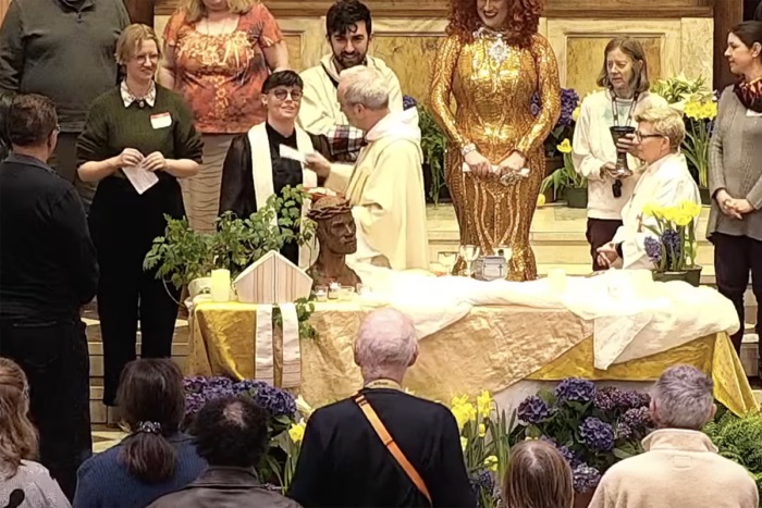 This story got a lot of attention because the Episcopal Bishop of Boston removed the collar of the female priest who leads the local LGBTQIA+ group at the Easter Vigil Mass. But look in the background. That's a drag queen behind the altar who serves as the emcee. Really?