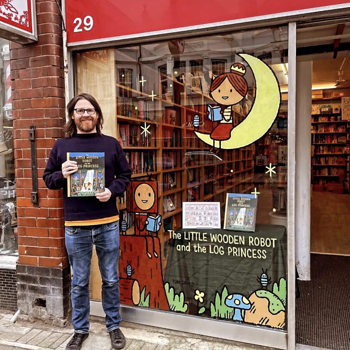 I painted the window of the delightful @childrensbkshop in Muswell Hill with The Little Wooden Robot and the Log Princess. Signed copies of the book and a special print are available now from their shop or website: childrensbookshoplondon.com