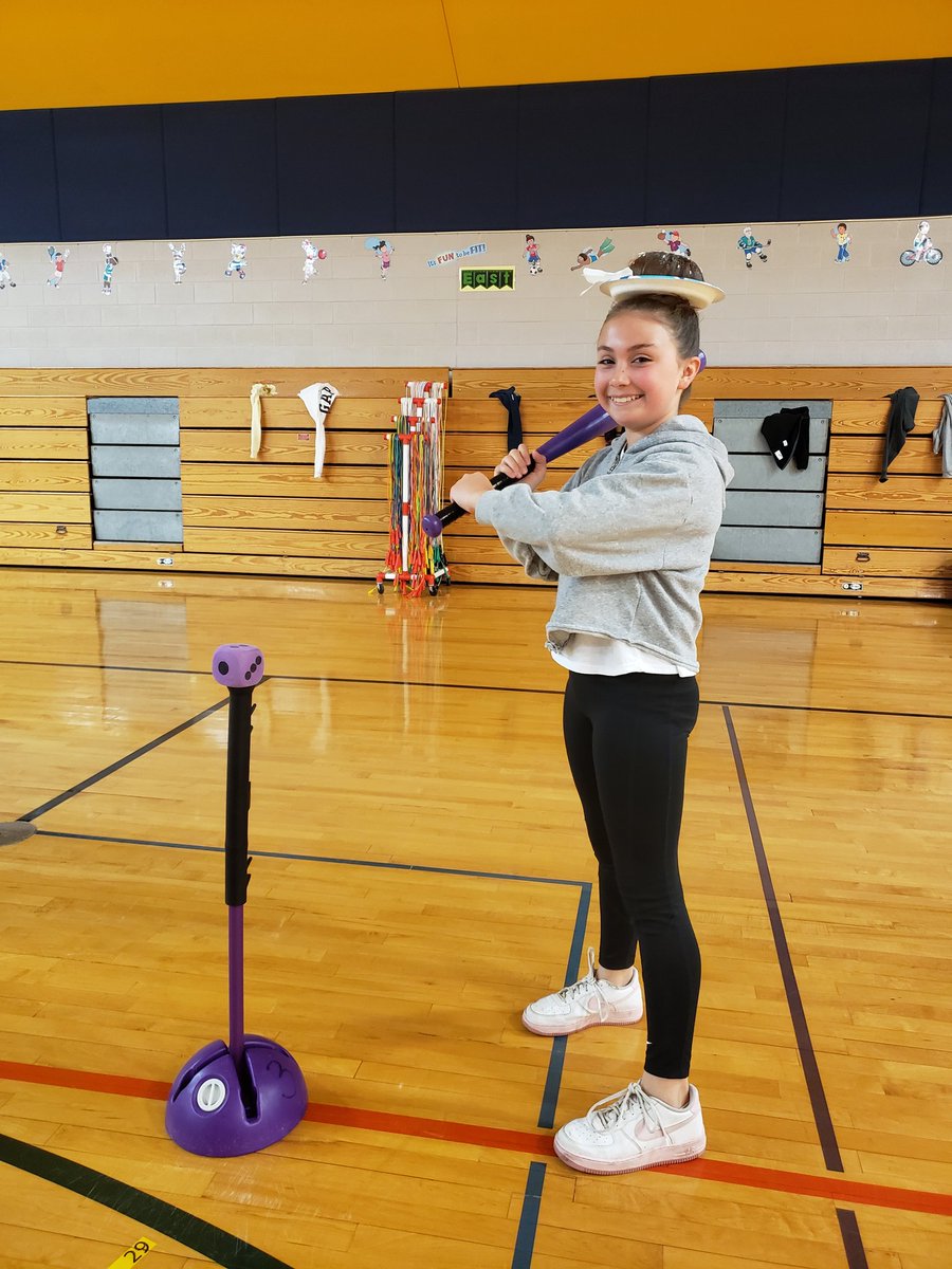 This awesome 5th grade #sayresharks is not afraid to bat even though she has a donut on her head!  <a href="/SLCSSayre/">Sayre Elementary</a> #SLYONphysed #physed