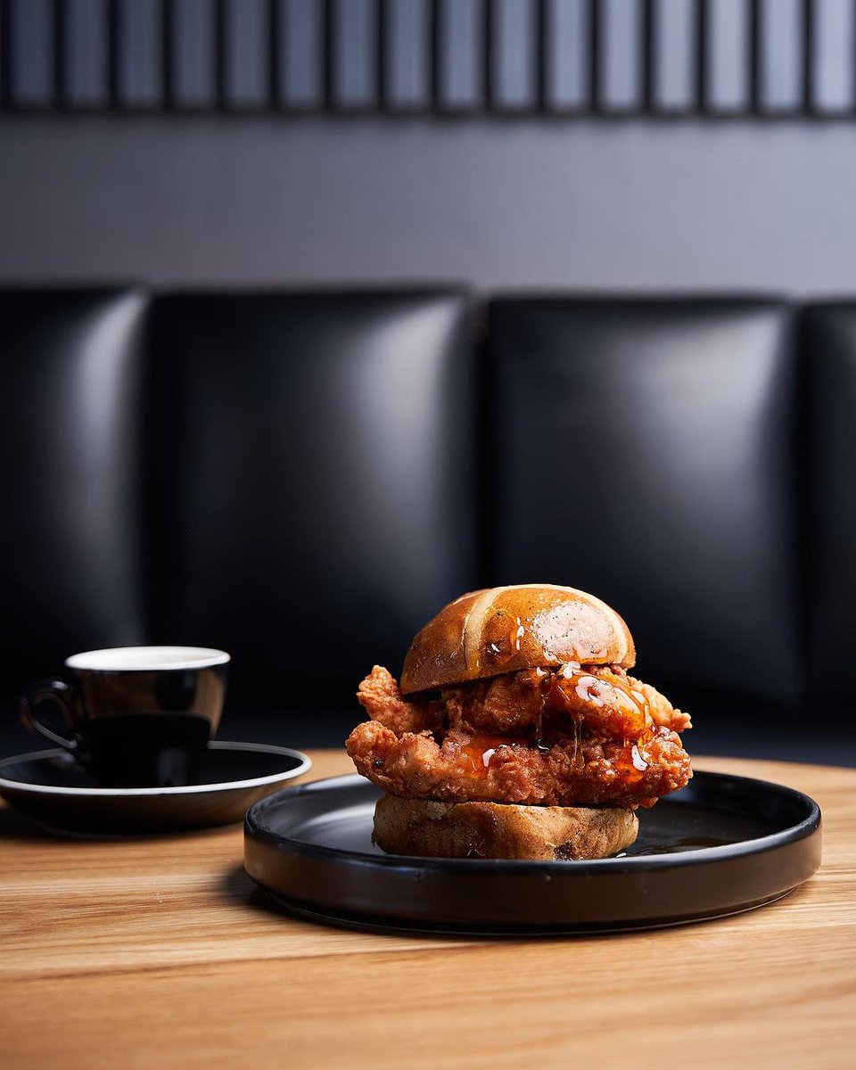 Savour and embrace autumn’s cosy vibes with the maple fried chicken bun from @BootleggerCC. 🍁😋 #TheZoneRosebank #OnlyAtTheZone #BootleggerCoffeeCompany