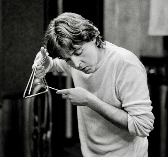 Paul McCartney, probably making a triangle sound amazing.