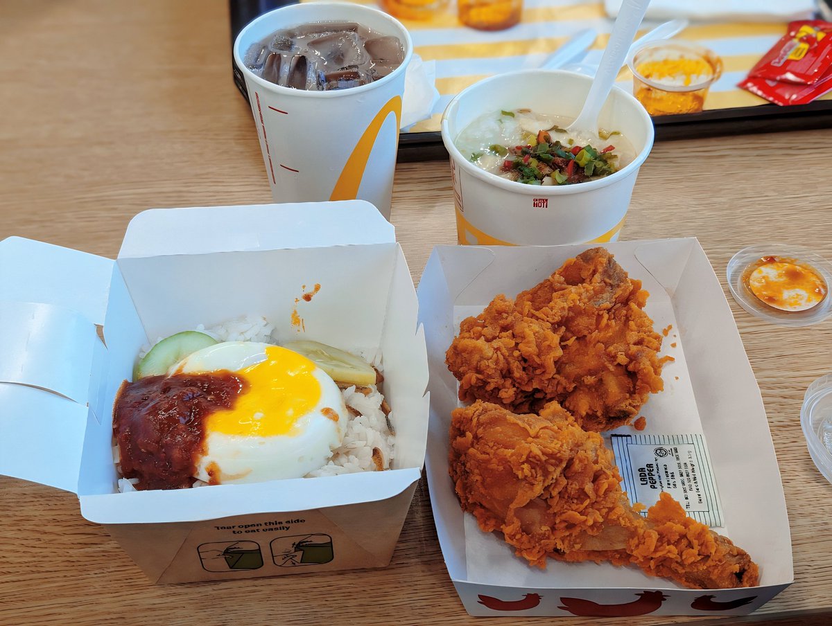 Just landed in 🇲🇾🥳 Our first meal in Malaysia! They have nasi lemak, ayam goreng, AND congee at McDonald's??? I could die of happiness 😭
