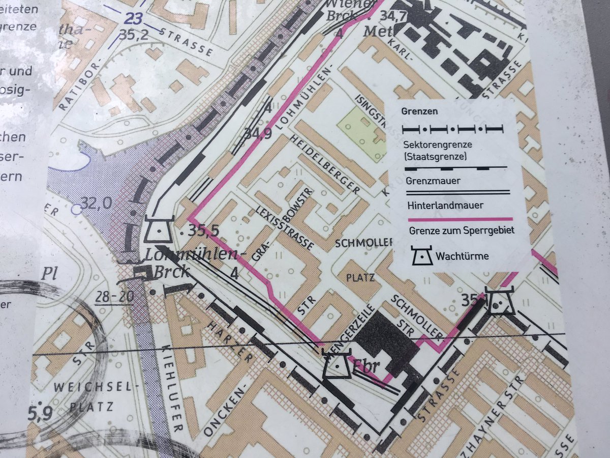 On Harzer Str, like Bernauer Str, the street and the sidewalk were in the West (Neukölln) and the border ran along the front doorsteps. So today you have historic structures to the West and post-1990 buildings to the East. And Some gaps are still being filled over 30 years later.