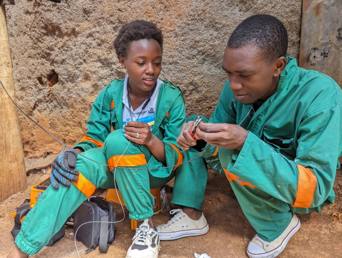 Ruth Njeri shares her daily work at #TandaCommunityNetwork in Kibera on LinkedIn, often seen on rooftops and ladders, adjusting wires and satellite dishes in her green safety coveralls. She aims to inspire young women in #tech careers and build a supportive online community.