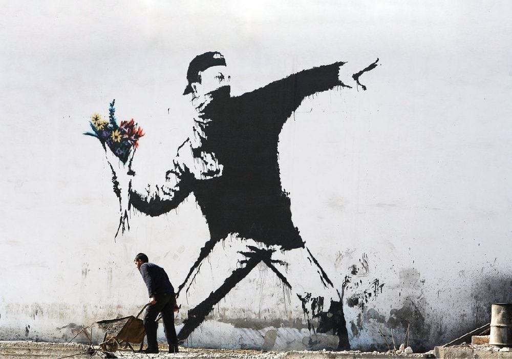 11. Flower Thrower, also known as Love is in the Air, by Banksy

'Art is to console those who are broken by life' - Vincent van Gogh