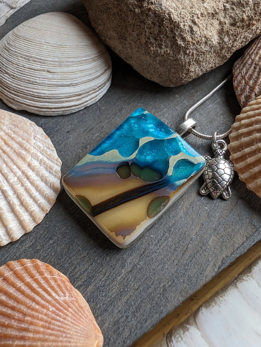 Wonderful unique handcrafted beach Inspired fused glass necklace. Lovely puddles of blues within this pendant. #handmade #beachjewellery #etsy #giftideas #shopindie buff.ly/49WsXUD