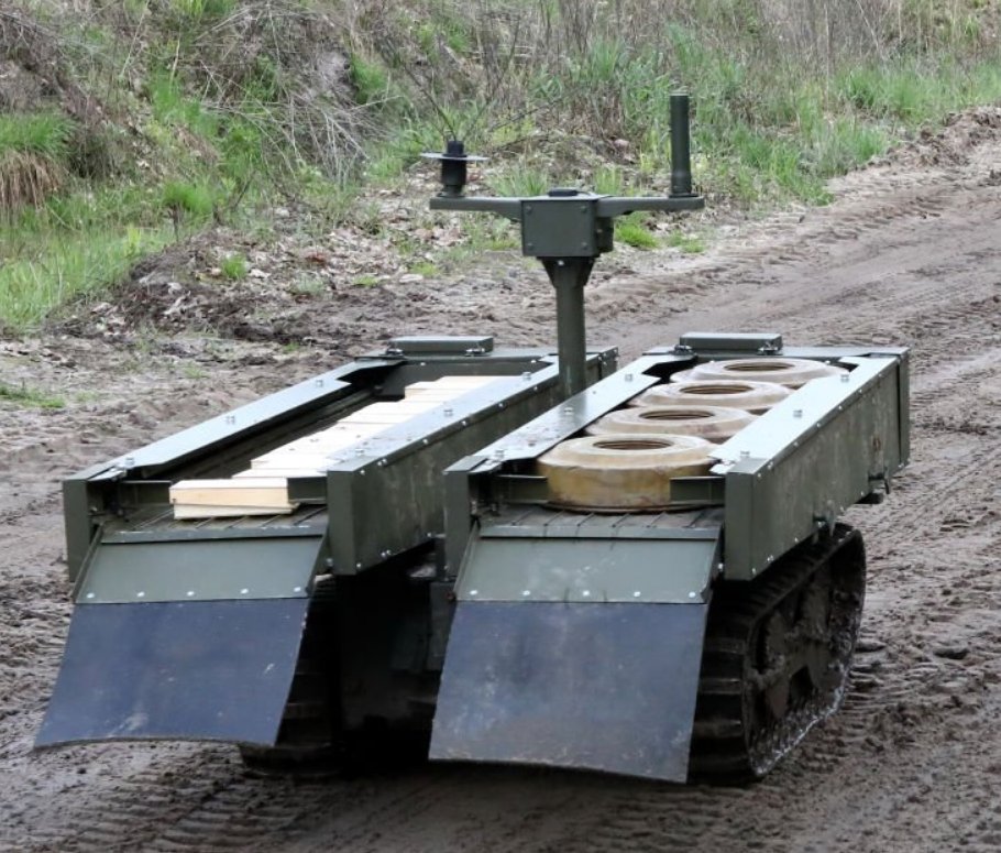 Interesting 'VEPR' UGV photographed in Ukraine as part of a field training exercise for the Liut Brigade. The radio-controlled UGV is shown with two mine dispensing racks, one loaded with TM-62 mines and the other with something else. Could be some sort of locally made box mine.