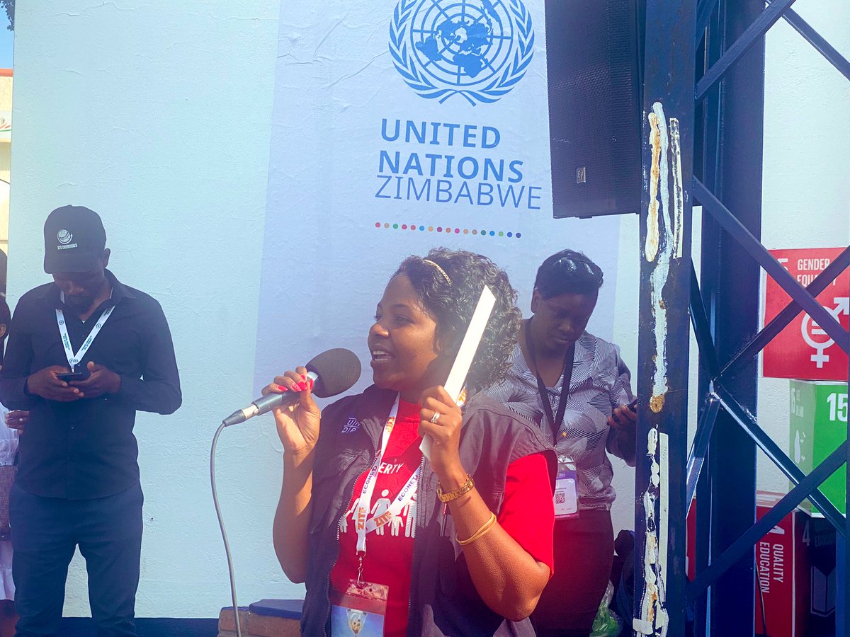 UNZimbabwe's tweet photo. Members of the public interact on #SDGs, @UN work in #Zimbabwe with @UNZimbabwe team at #ZITF2024 in front of the #UN at information stand.  Led by @UNDPZimbabwe Communications Officer Valentine Gwerevende #ForPeopleForPlanet https://t.co/EXFhN5SWRj