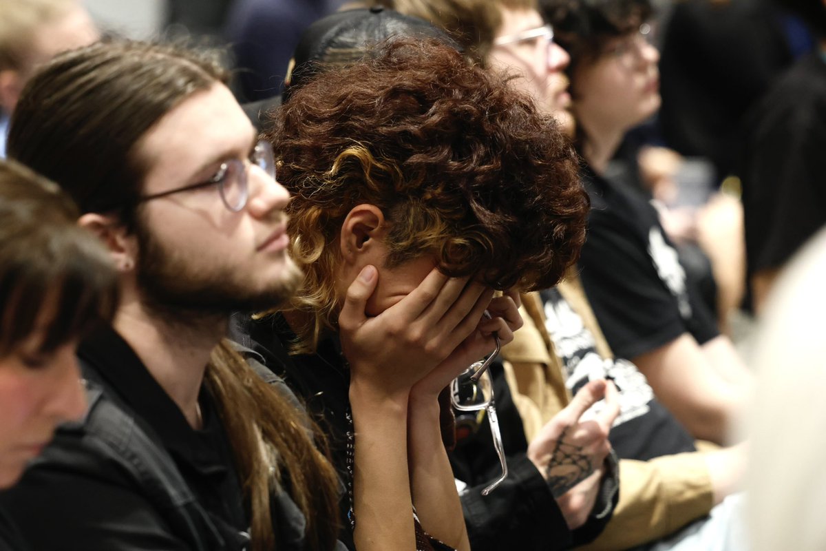 UK student Kamryn Lin puts their head in their hands during the Board’s vote, passing 19-1 today. Photo by Abbey Cutrer | Staff