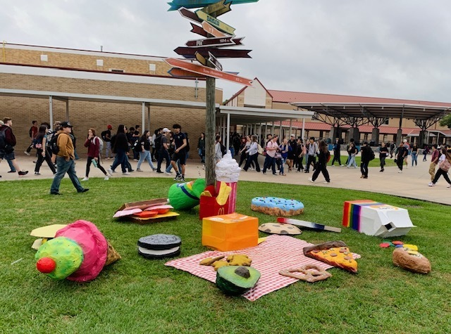 AlvinHSJackets's tweet photo. What a feast on the lawn of AHS! 🍕 Art classes collaborated on larger-than-life food sculptures, turning the campus into a whimsical picnic spot. Let's just hope we don't catch the attention of giant ants! 🐜🍩🎨 #ArtInstallation #CreativeCampus #GiantPicnic https://t.co/QuCVZE8lQ1