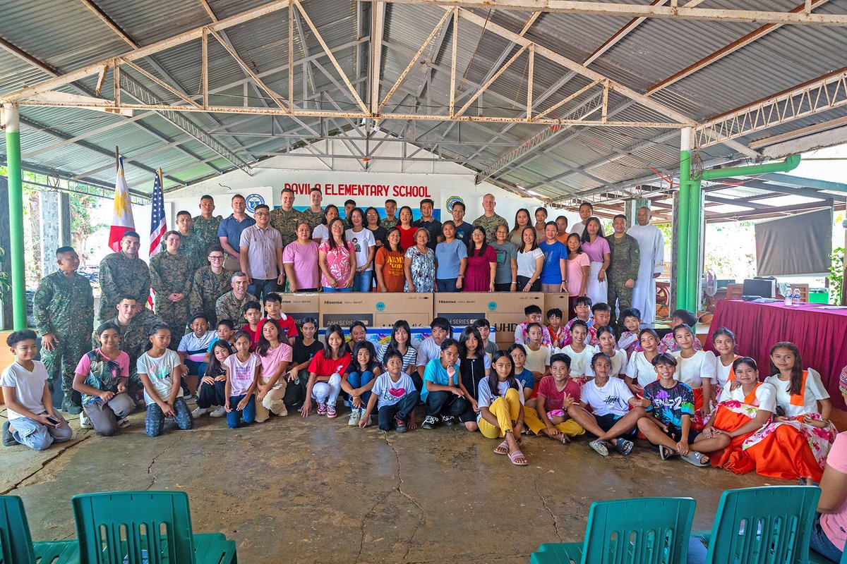 USMC Col. David J. Fennell, commanding officer of 1st Civil Affairs Group & CJCMOTF commander for Exercise Balikatan 24, delivered crucial educational resources to Davila Elementary, Pasuquin, enhancing student learning. BK 24 strengthens US-Philippines military cooperation.