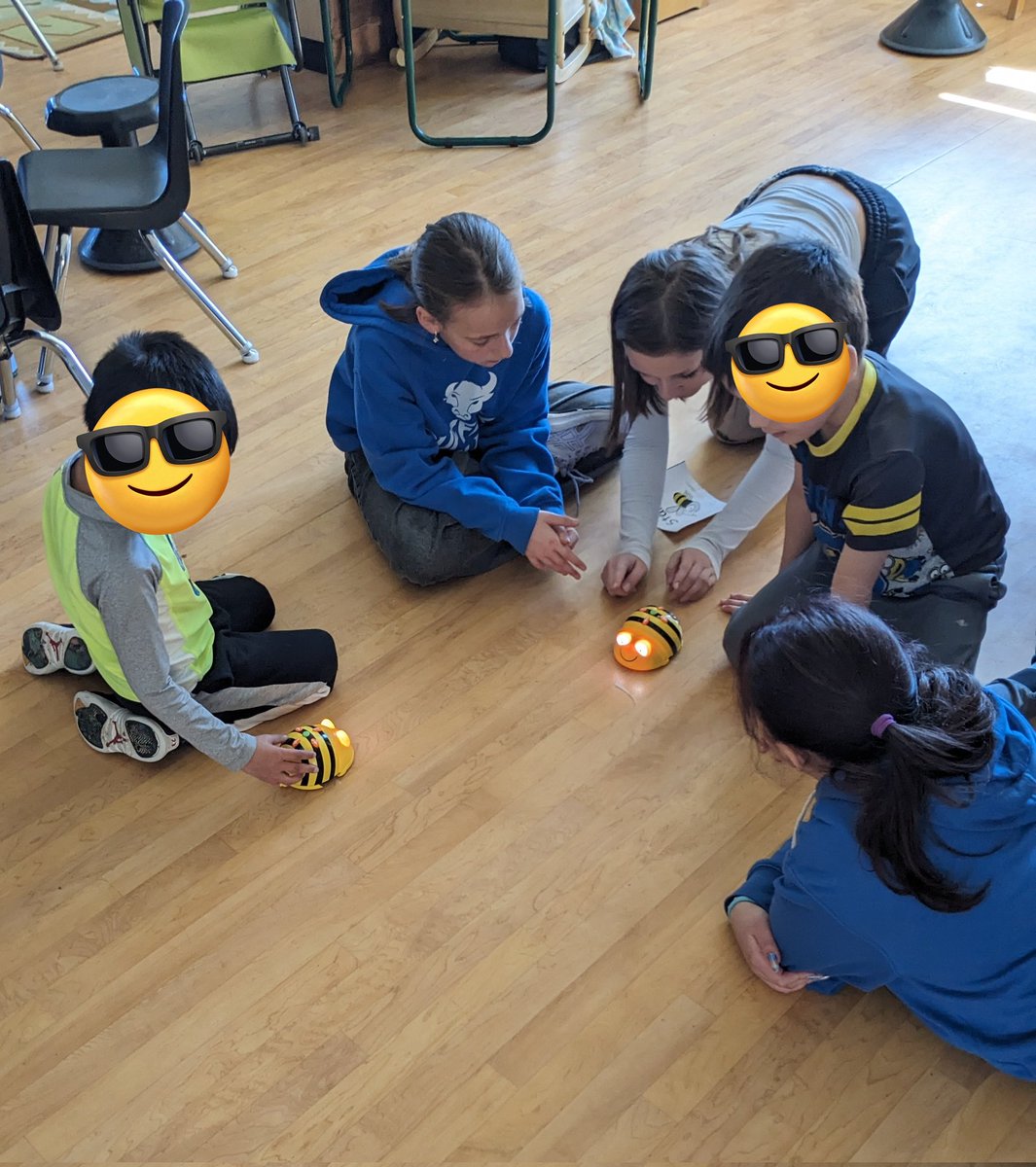 's tweet image. My students are showing the kindergarten group how to do some age appropriate coding. 

We have these Bee Bots in all of our libraries. 

The group of girls in charge designed a course that failed. They are working on fixing their ideas so it's more efficient. @StDanielTBirds