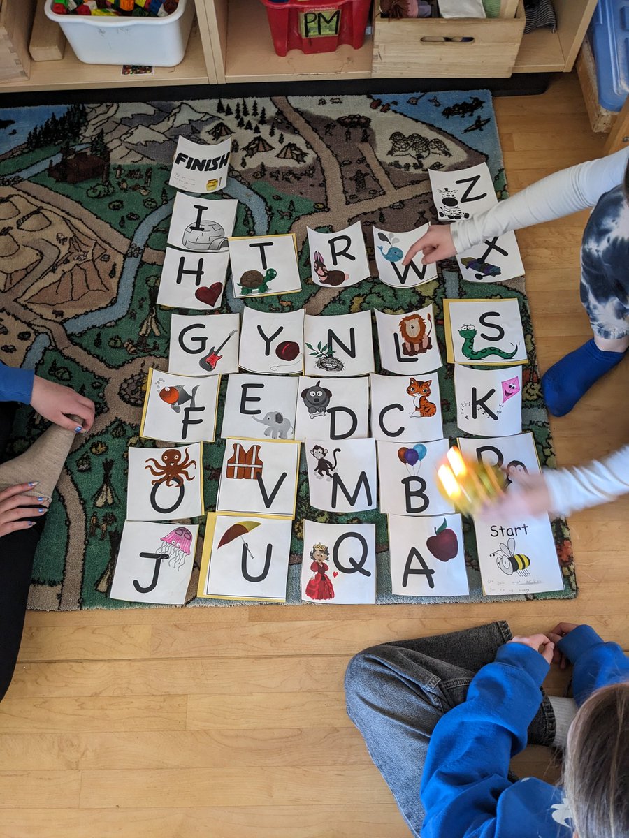's tweet image. My students are showing the kindergarten group how to do some age appropriate coding. 

We have these Bee Bots in all of our libraries. 

The group of girls in charge designed a course that failed. They are working on fixing their ideas so it's more efficient. @StDanielTBirds