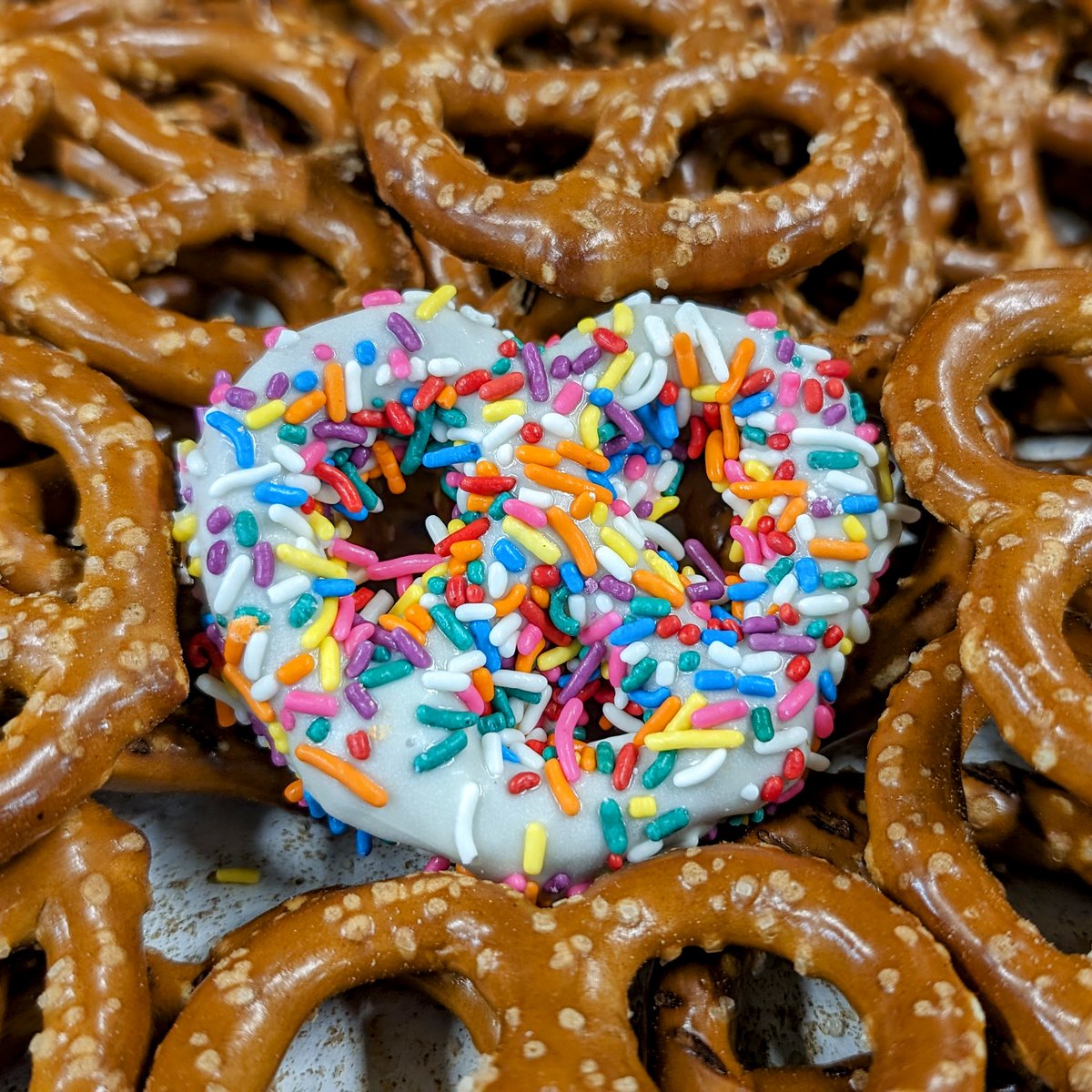 Cheers to National Pretzel Day from the one who's a little twisted, dipped in white chocolate, and sprinkled with joy! 🥨🍫✨ #candystore #SpreadJoy #sweetandtwisted #nationalpretzelday