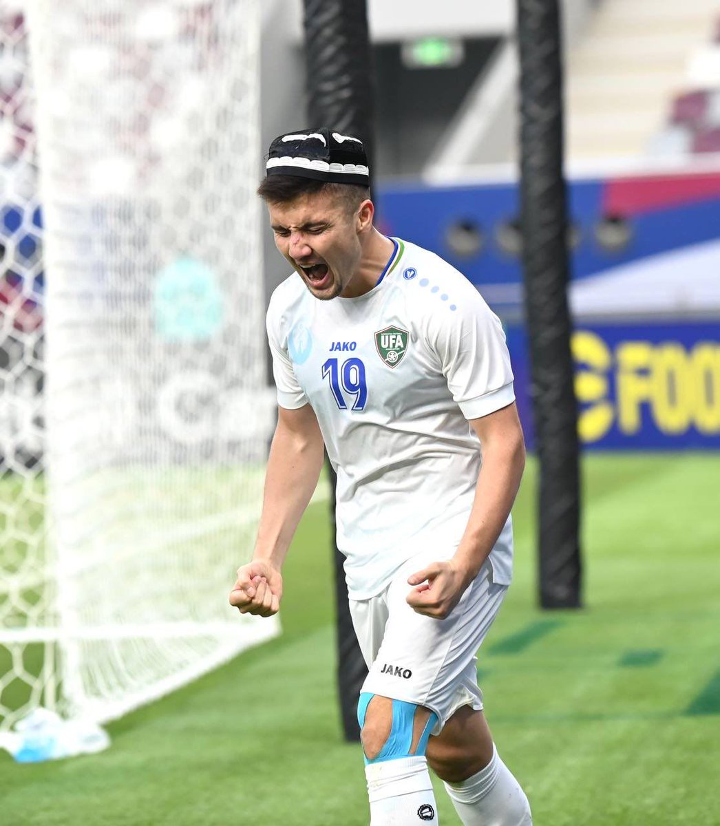 Uzbekistan 🇺🇿’s Khusain Norchaev celebrating with a traditional Uzbek Qalpoq after his goal v Saudi Arabia 🇸🇦 that saw the Uzbeks go to the #AFCU23 semis. A fantastic photo.