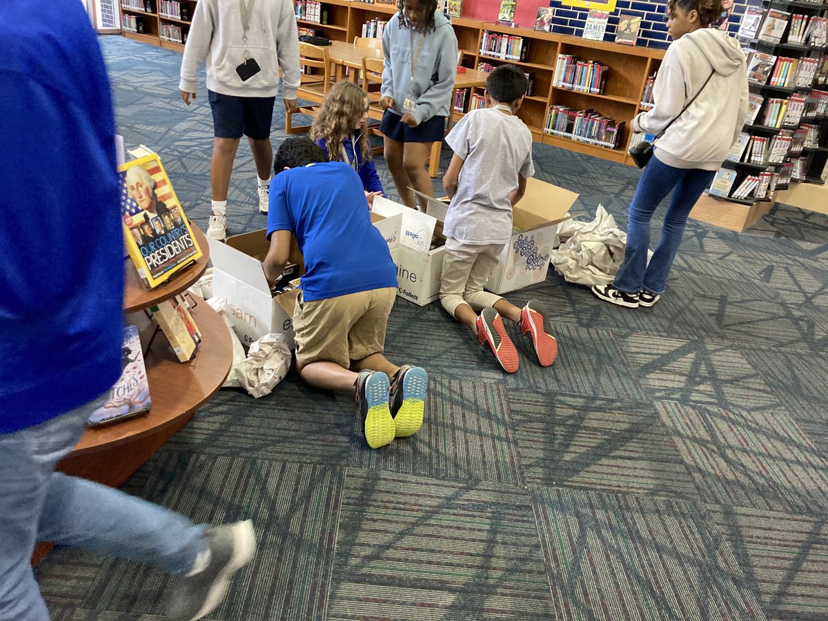 The excitement 🥳 when new boxes of books arrive and the lucky ones who happen to be present get to see what’s inside (and packing paper is everywhere) ⁦@pinoakms⁩ #txla #txasl #SchoolLibraryMonth 📦 📚📦📚
