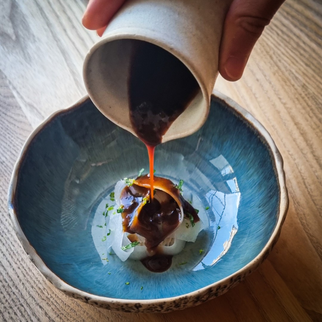 New addition to our tasting menu: Crab, Daikon, Mint. Daikon ribbons conceal white crab, topped with citrus puree, lime zest, fresh mint. Finished tableside with warm roasted shell sauce, crab XO. 🦀🌿