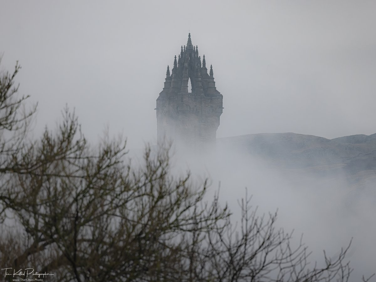 Mysterious views of Stirling's iconic National Wallace Monument surrounded by the swirling mist 🏴󠁧󠁢󠁳󠁣󠁴󠁿. Taken by @TheKiltedPhoto 📸. #VisitScotland
