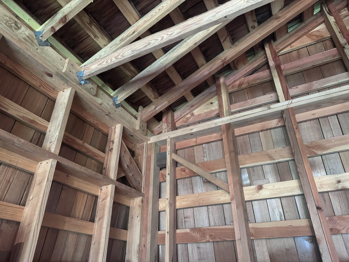 Tell me, is this overbuilt?  Except for a small section of 2x6”, studs are 4x6” @ 23.5” on center.  Eves are full length 6x12” beams.  Other than being cedar shake the roof is standard except spanning the width is a 3x12” beam sitting on 6x6” columns to the foundation.  Gantry?