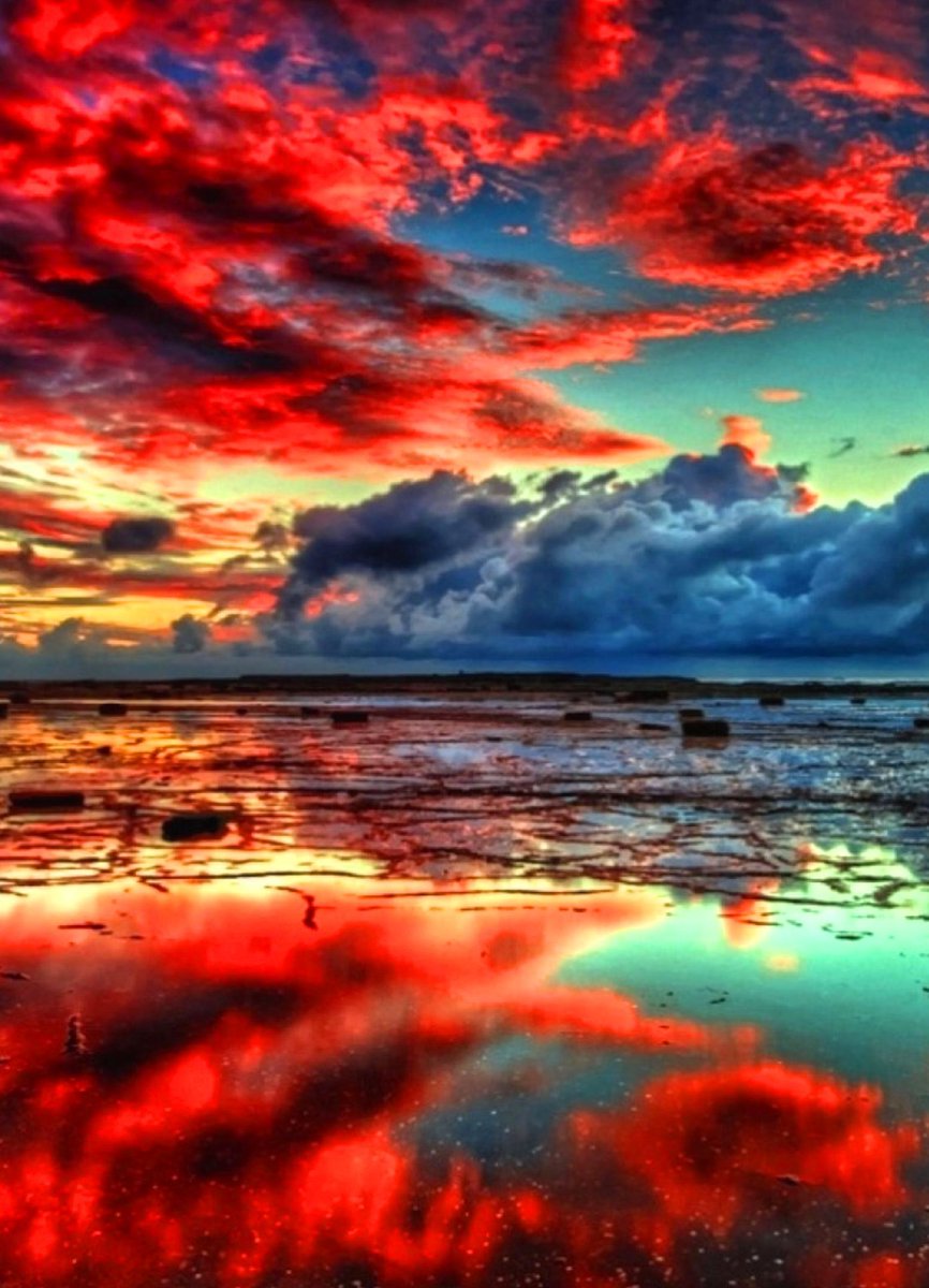 Red sunset clouds at the sea offings