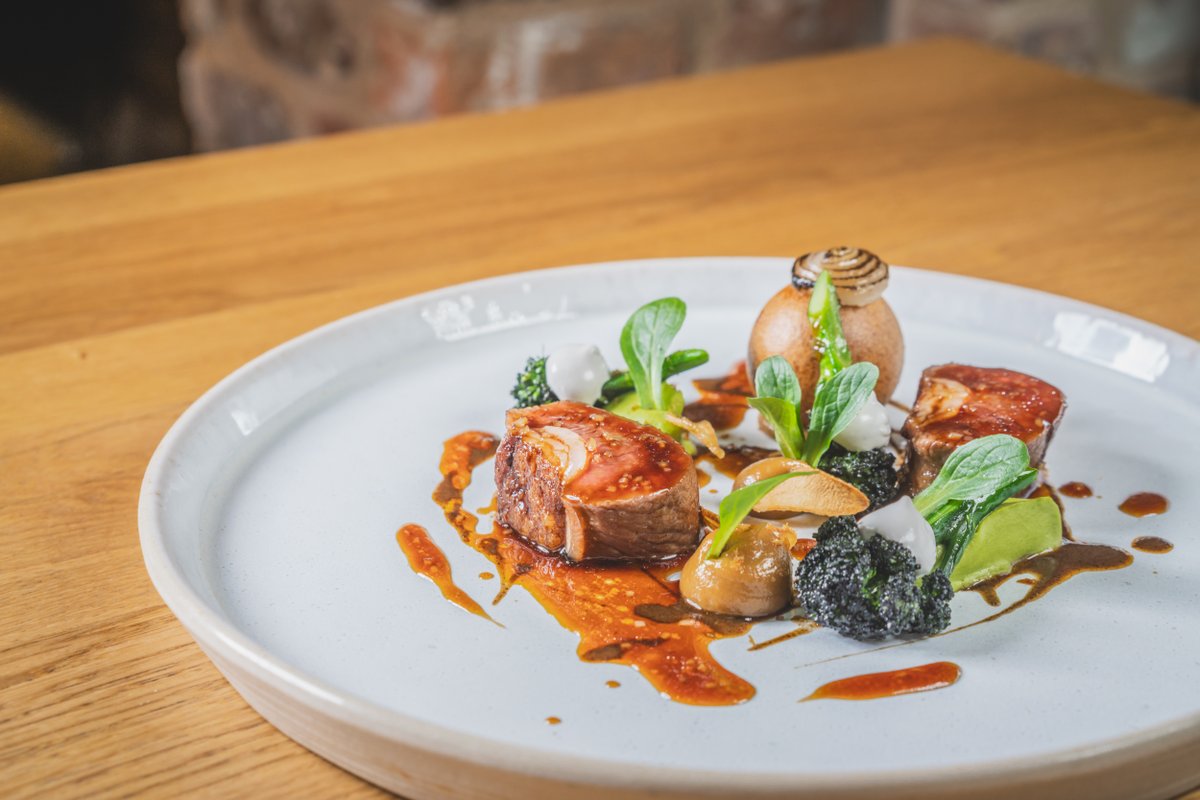 Herdwick lamb loin and braised shoulder, grilled purple sprouting broccoli, shallot and anchovy. We pride ourselves on delivering dishes inspired by the seasons, crafted with produce grown in our own back garden and further afield #MICHELINGBI24 #OneMICHELINStar24