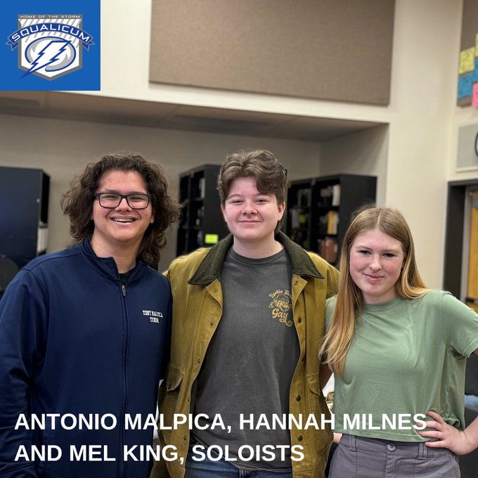 Three Squalicum vocalists heading to state pose for photo in classroom