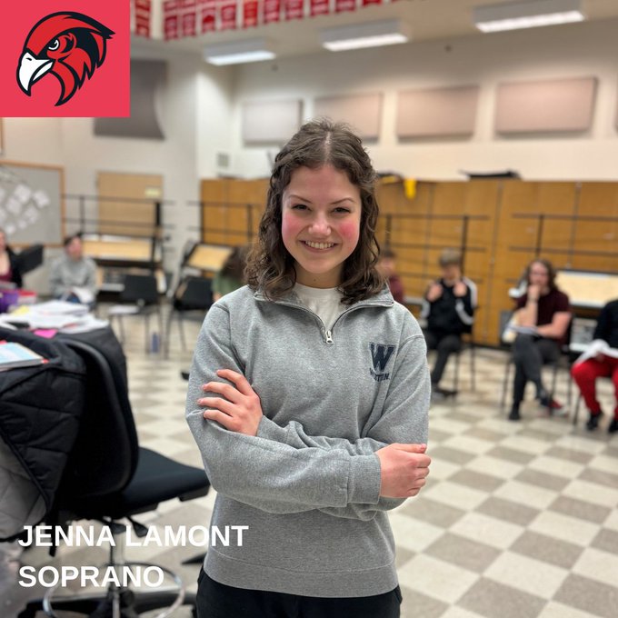 A vocalist poses for a photo in a Bellingham classroom