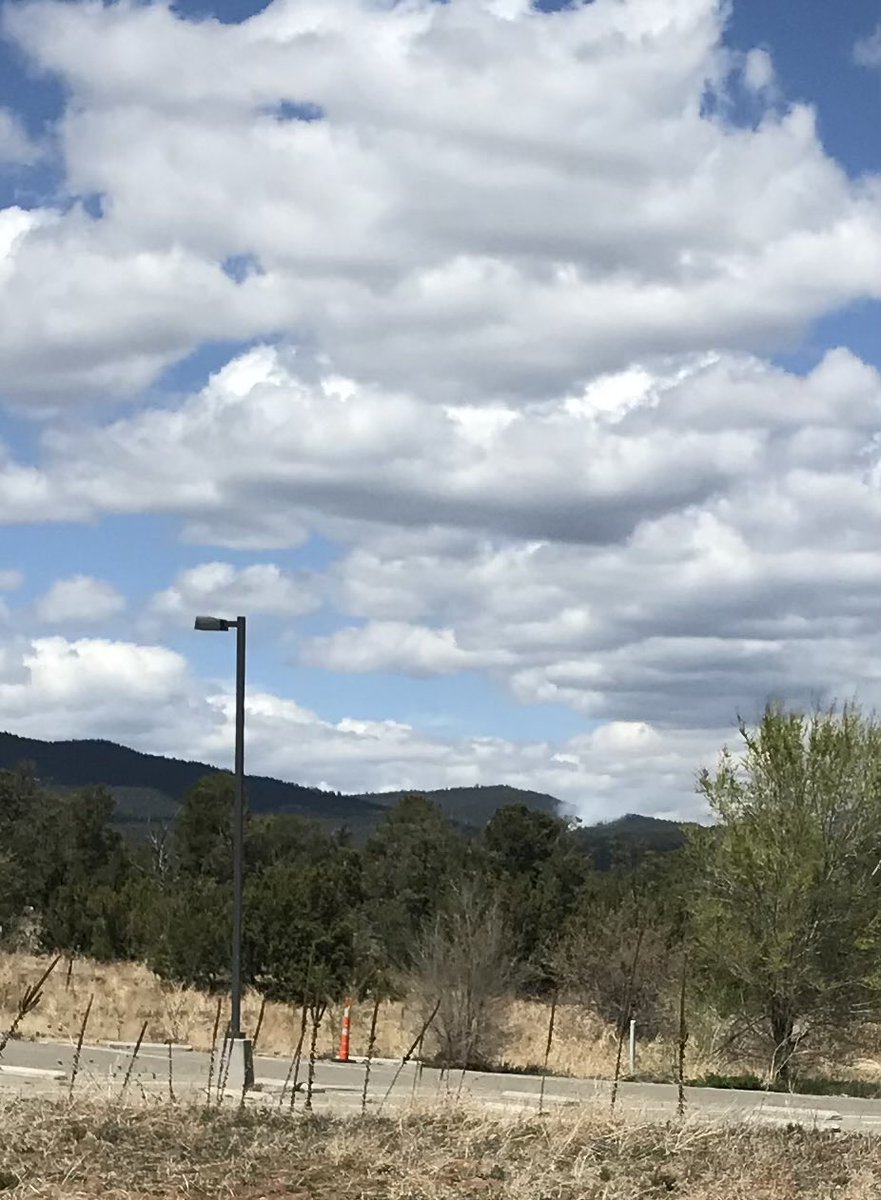 A friend took this photo and said the smoke from the #DryGulchFire was getting bigger. (It’s hard to see from so far away but it’s to the left of the tree.)  #NMFire