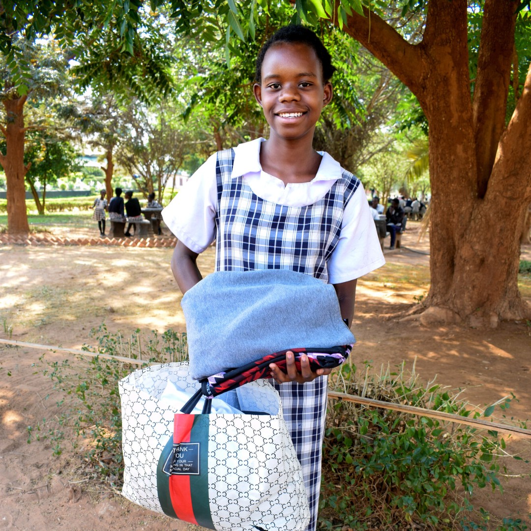 Welcome to Photo Friday! These sponsored children in Zambia have received the gift of special money. This money can be spent on any special need they may have; including clothes, uniforms, birthday presents, and even building materials for their homes.