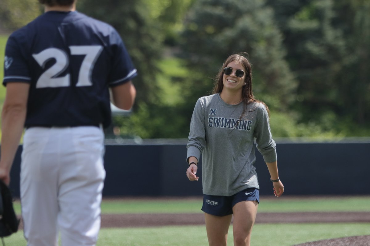 XavierSWIM's tweet photo. .@XUAthletics Teammate of the Year winner, Erin Ritz, throwing out the first pitch ahead of @XavierBASE's win over St. John's today! https://t.co/Ag1MHIsToy