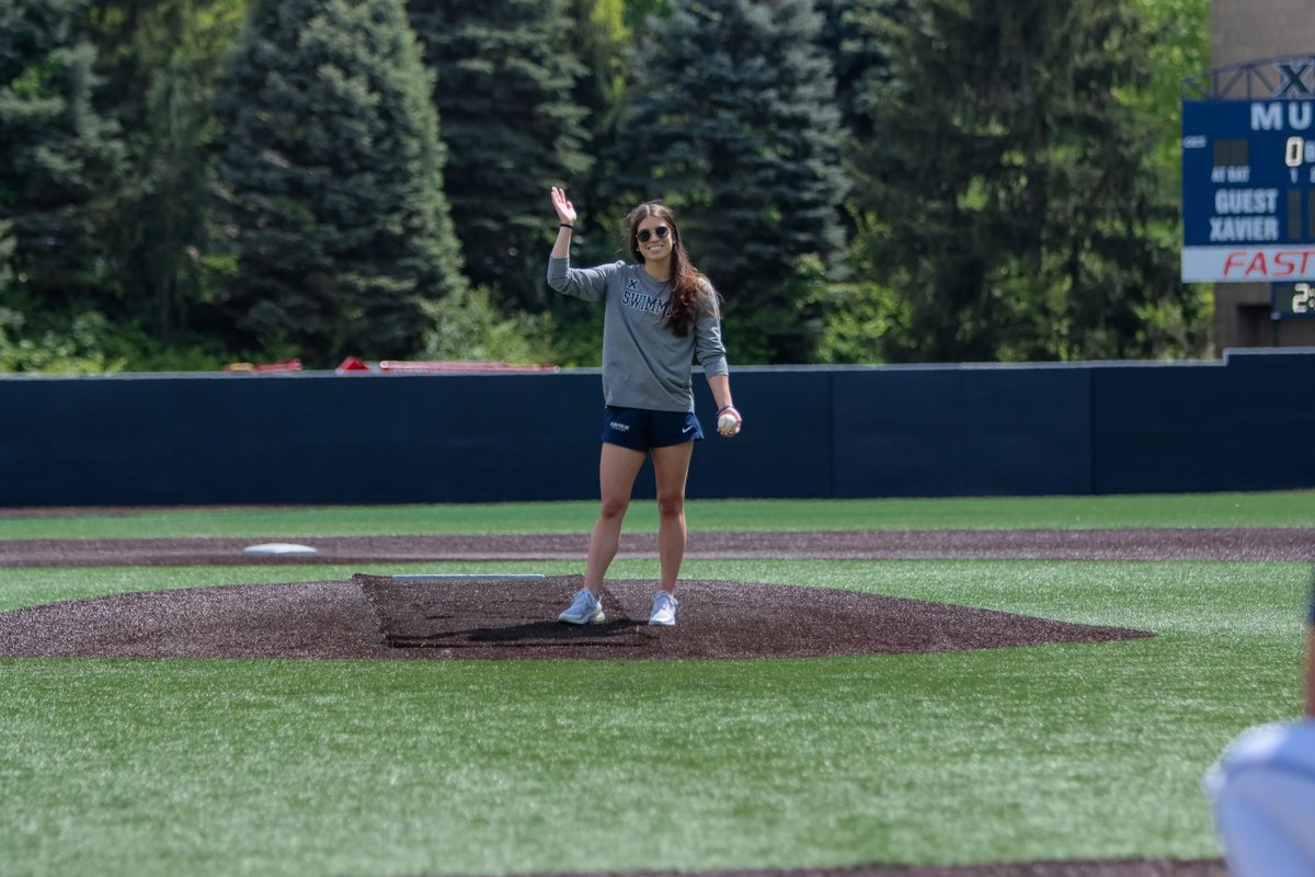 XavierSWIM's tweet photo. .@XUAthletics Teammate of the Year winner, Erin Ritz, throwing out the first pitch ahead of @XavierBASE's win over St. John's today! https://t.co/Ag1MHIsToy