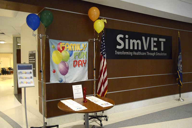 VAInnovation's tweet photo. SimLEARN hosted its inaugural Family Day at the National SimVET Center. Over two dozen children engaged in hands-on experiences with hologram and virtual reality technology, moulage creation, and CPR training. #SimLEARN #FamilyDay #HealthcareSimulation https://t.co/gRXJQMG0It