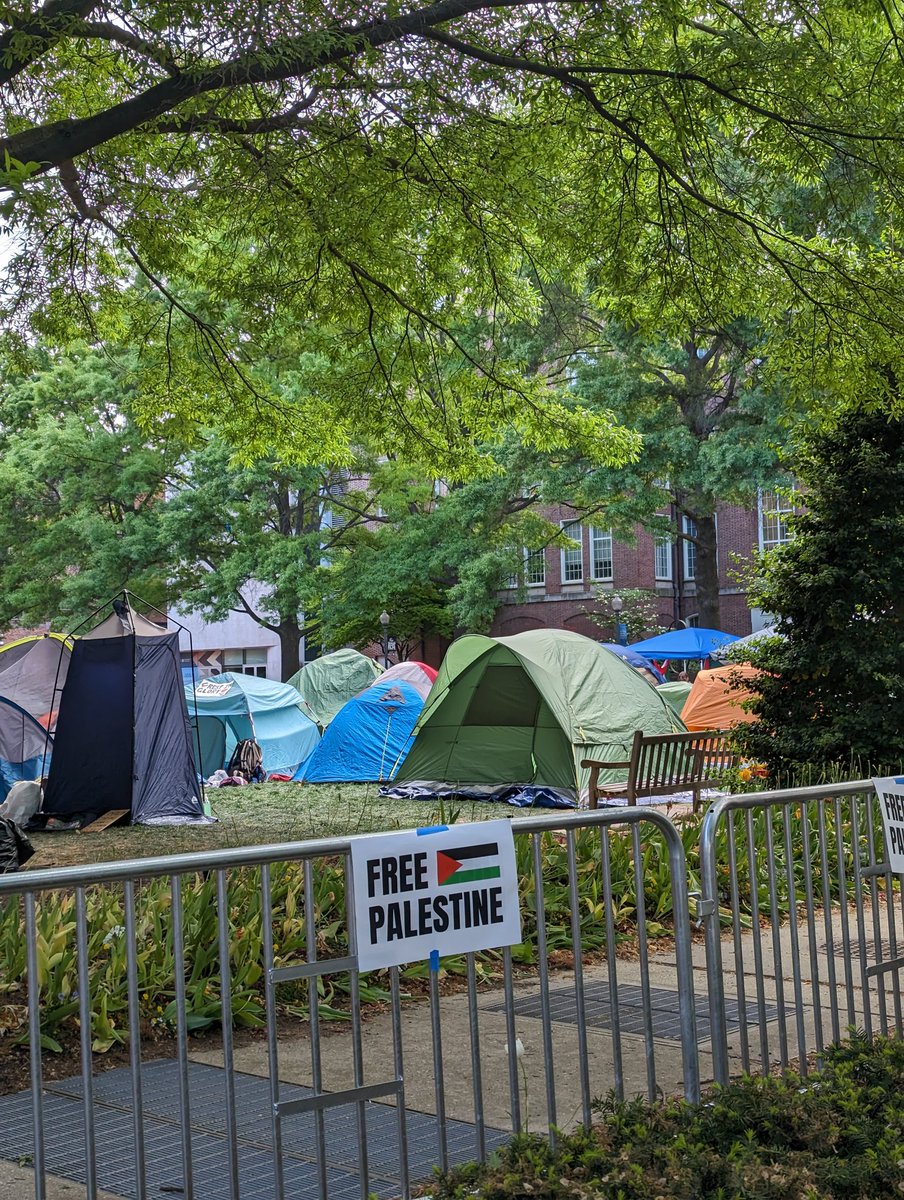 DC turns out in support of the DMV student encampment at George Washington University. Police have barricaded the encampment with students in the yard, but community members fill the street in front of it.