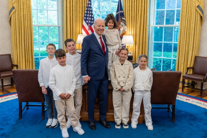 Abigail and members of her family meet with President Biden in the Oval Office.