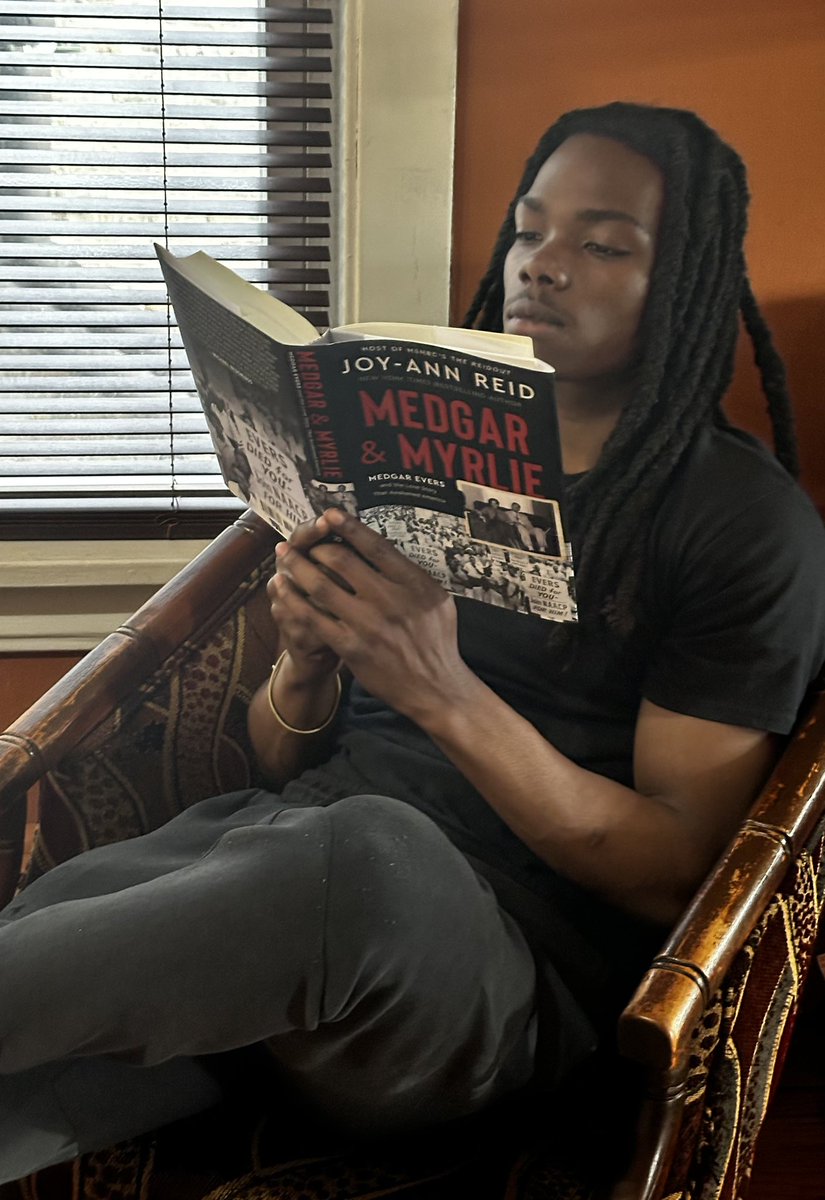 SodengiJ's tweet photo. @JoyAnnReid Congrats again! I wanted to share that our great niece came to visit with her 22yr old friend. While waiting for her, he chose your book from our library to read! During our discussion, prior to this, he wasn’t familiar with the Evers! 
*He ok’d us sending the picture. https://t.co/lpVbcZ3WZB