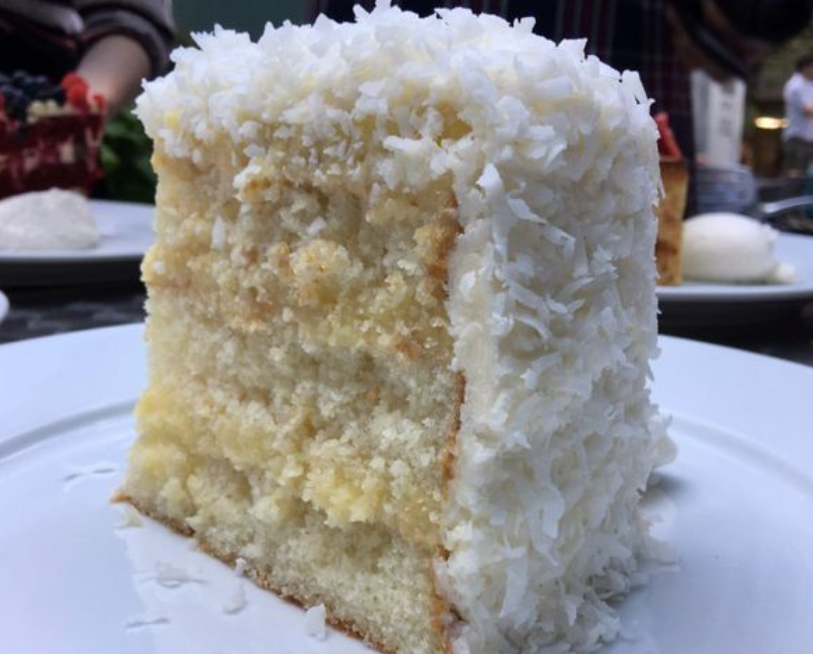 'Indulging in a slice of triple layer coconut cake today! 🥥🍰 Moist, fluffy layers with creamy coconut frosting - the perfect treat for any occasion. Who else loves coconut desserts? #coconutcake #sweettooth #dessertlover'