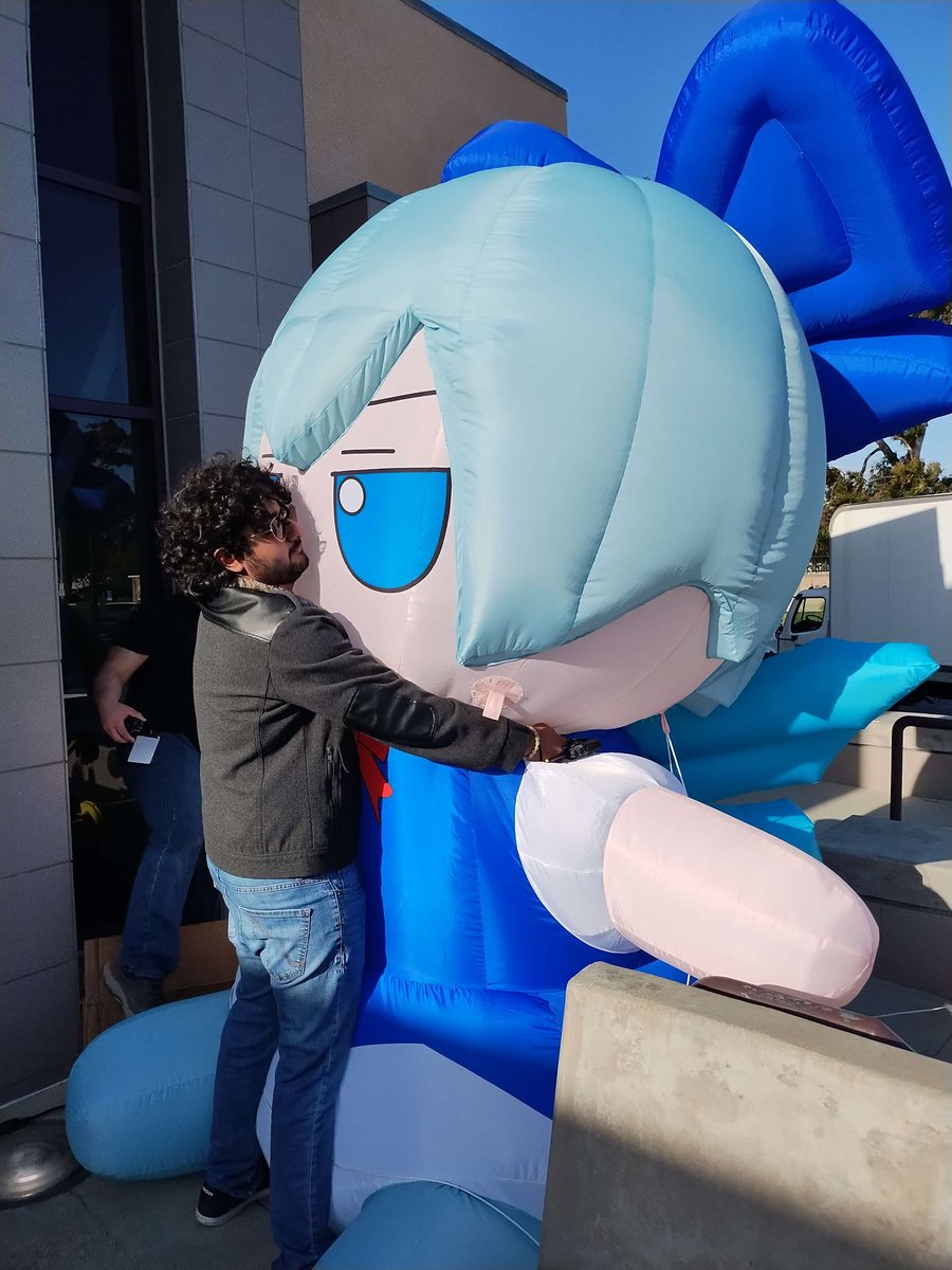 This is me. My job is to hug the giant cirno fumo. If I stop, she will fly away, so I must stand here hugging her at all times.