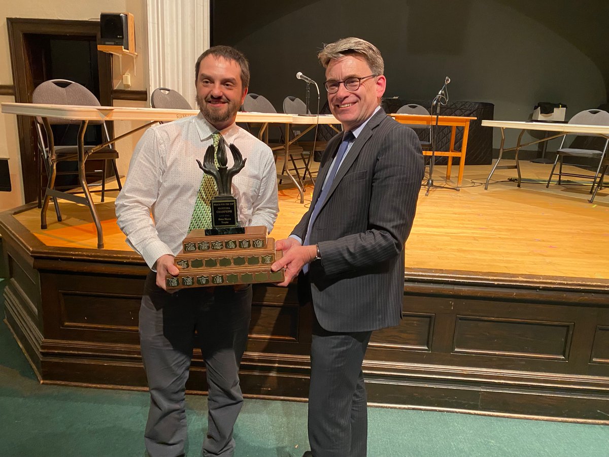 At the provincial Reach for the Top championships w/ @ScottGillingham . Congrats to @cmmc_RETSD ! And Coach @gordonfritzsche ! Presenting the recently renamed “ Brian Mayes Trophy” to 1st time provincial winners Miles Mac.