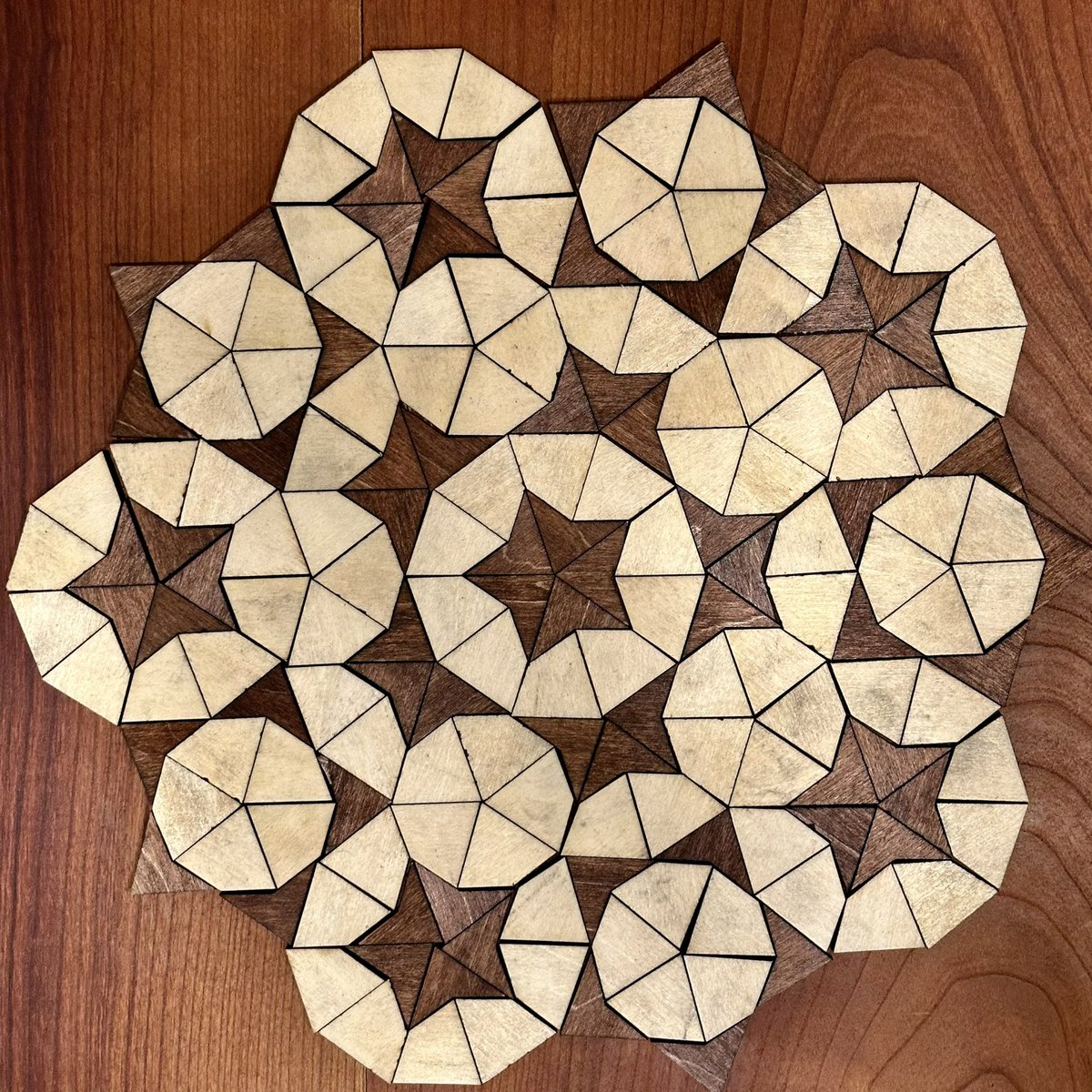 I made some wooden Penrose kites and darts.