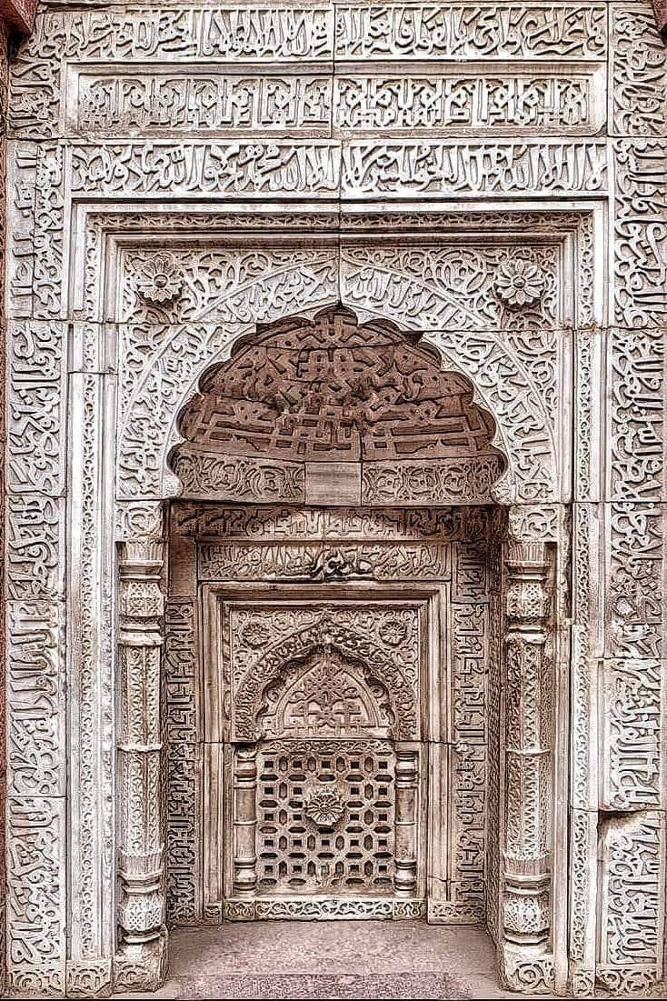 A 12th Century CE; Kufic style of Arabic (Quranic) Calligraphy and Geometric patterns, carving on the Mehrab of Iltutmish's (d. 1236 CE) Tomb at Qutub Complex, Mehrauli, New Delhi, India.

Tomb of Iltutmish, was built in 1236 CE. It is situated just outside north-west corner of…