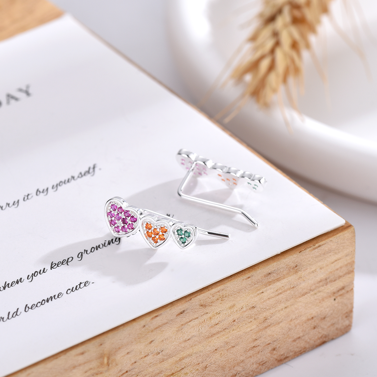 Brighten up your summer style with a splash of color! 🌟 Our 925 Silver Earrings Cuff with multicolor cubic zircon are the perfect accessory to any sunny day. ⛱️ Shine like the season with Guangzhou Dejavu Jewelry Co., Ltd. #SummerJewelry #SparkleAndShine #DejavuJewelry 🌈✨