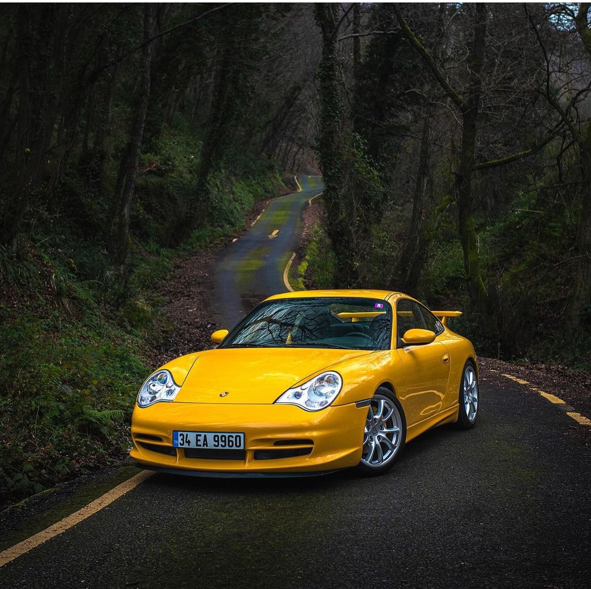 Exploring back roads in a vibrant Yellow 996 GT3 MK2 is a true driver’s delight! 🚗💨 This beauty in its natural habitat captured by Emre Aktolga perfectly showcases the essence of the Porsche driving experience. #Porsche996GT3