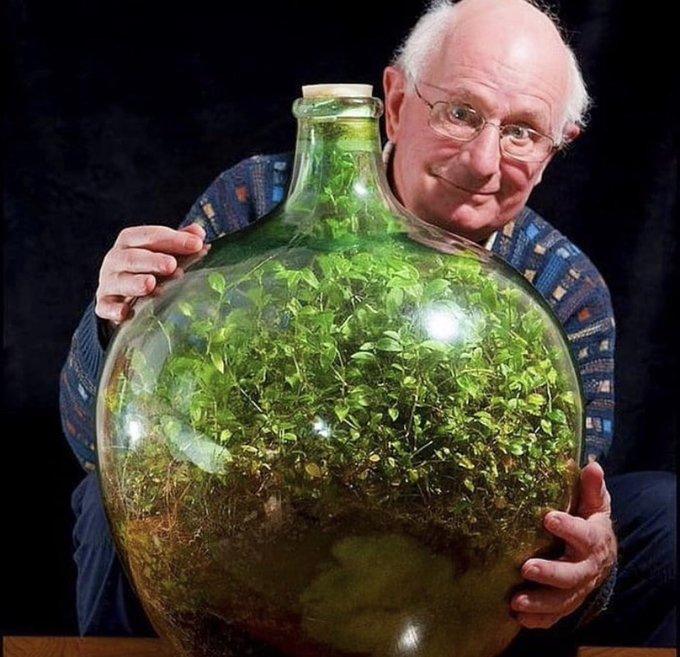 In 1960, David Latimer planted a spiderwort sprout inside of a large glass jar, added a quarter pint of water, and then sealed it shut. 

He opened the bottle for the first time only 12 years later, in 1972, to add some water and then sealed it for good. 

The self-contained