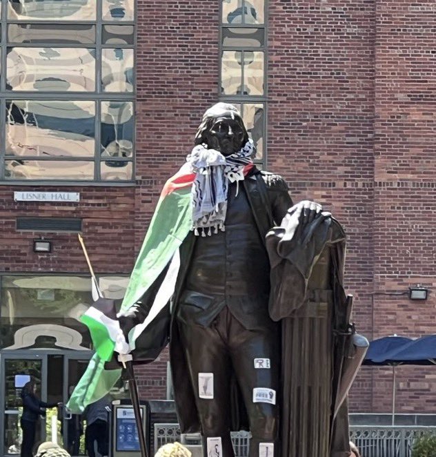 Disgraceful ~ ~ Protesters at GWU have dressed a statue of George Washington in a Palestinian flag and keffiyeh scarf. Credit: @theblaze
