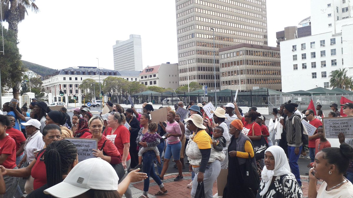 The people march past the @ParliamentofRSA parking spot. A vastly underutilised piece of land, solely used for parking. We need affordable housing here - it would be low hanging fruit to champion and even then there is resistance to developing it. #land4peoplenot4parking