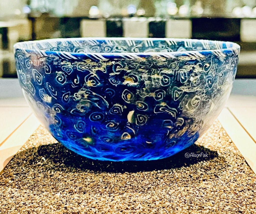 A 2,000 year-old Hellenistic mosaic glass bowl made of translucent dark blue glass with white spirals. Looks as if it contains the cool blue waters of the Mediterranean Sea! 🌊🌊🌊 Landesmuseum Württemberg, Stuttgart. 📷 my own #Archaeology