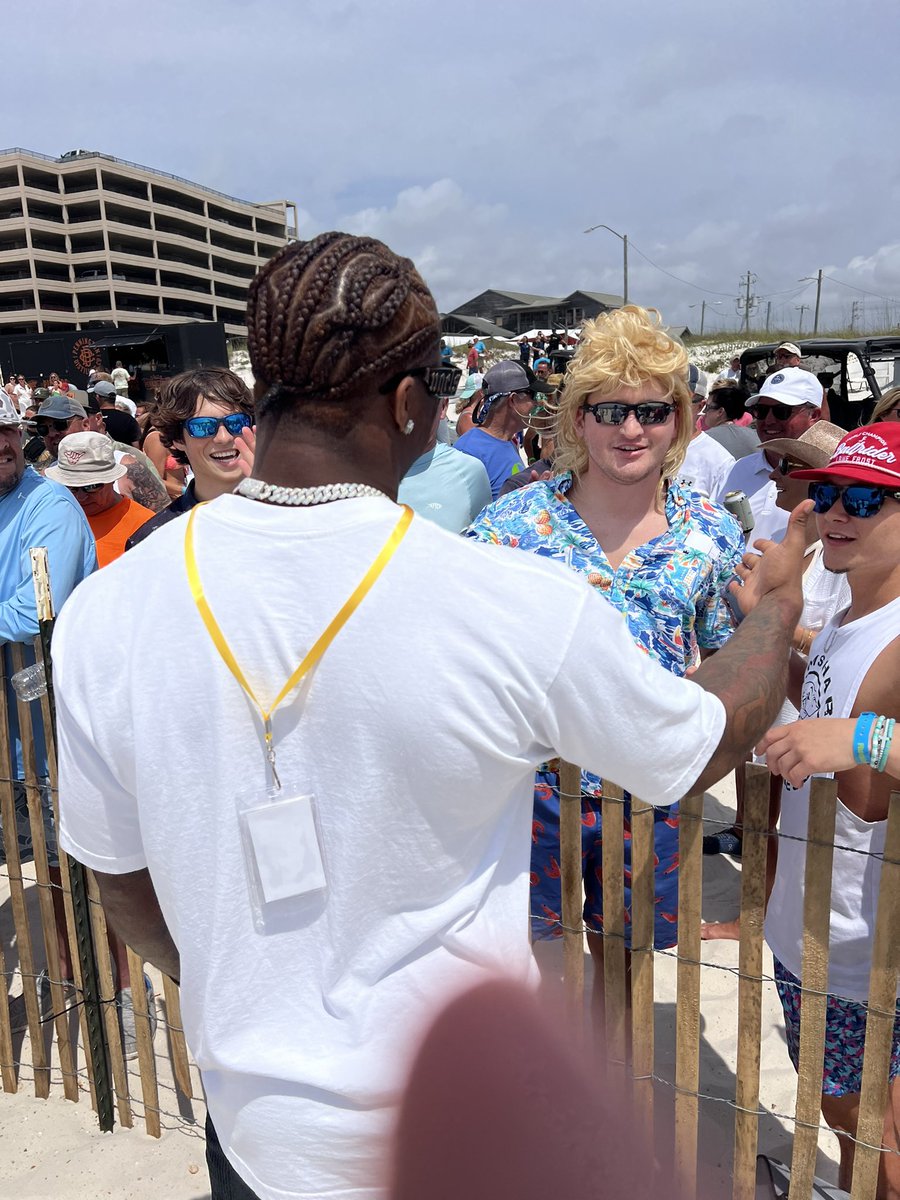 yea_ala's tweet image. Jalen Milroe and Malachi Moore taking in the scene of Mullet Toss at Flora-Bama