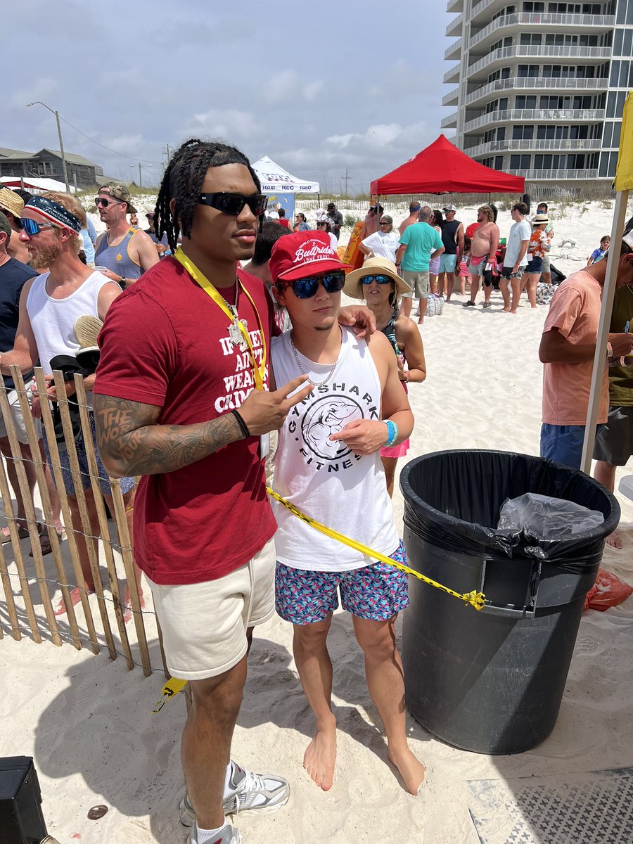 Jalen Milroe and Malachi Moore taking in the scene of Mullet Toss at Flora-Bama