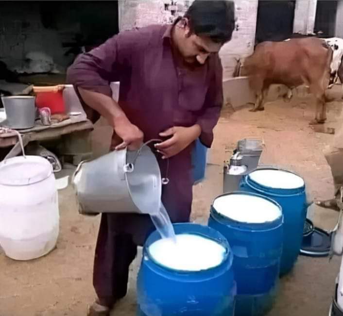 Good people still exist……. A humble man washing milk before selling it…….