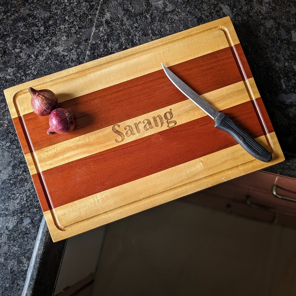Upgrade your kitchen game with our personalized wooden chopping boards! Not only are these boards sturdy and durable, but you can also add your own custom text to make it truly one-of-a-kind. #kitchengoals #personalizedchoppingboard #woodenwonders #kitchenaccessories #woodgeek